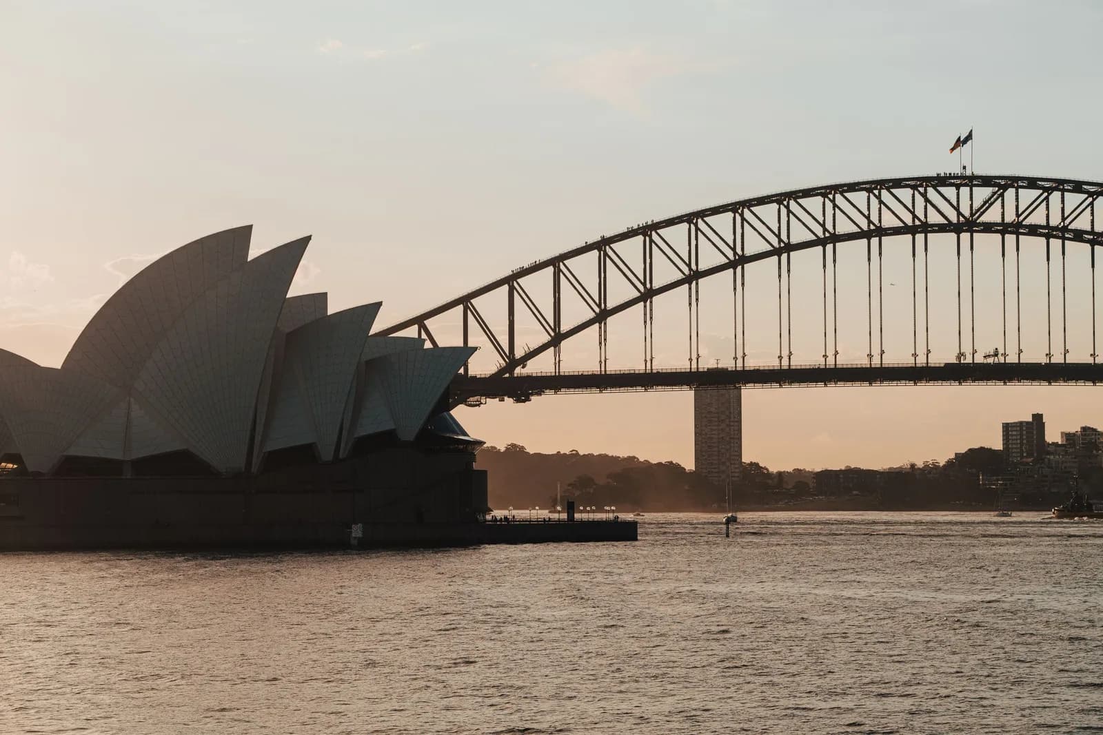 Sydney Harbour at dusk, with the Sydney Opera House and Harbour Bridge